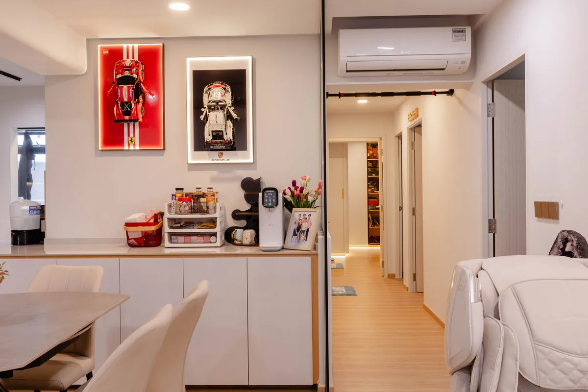 Dining area with white carpentry and warm lighting at Fernvale St