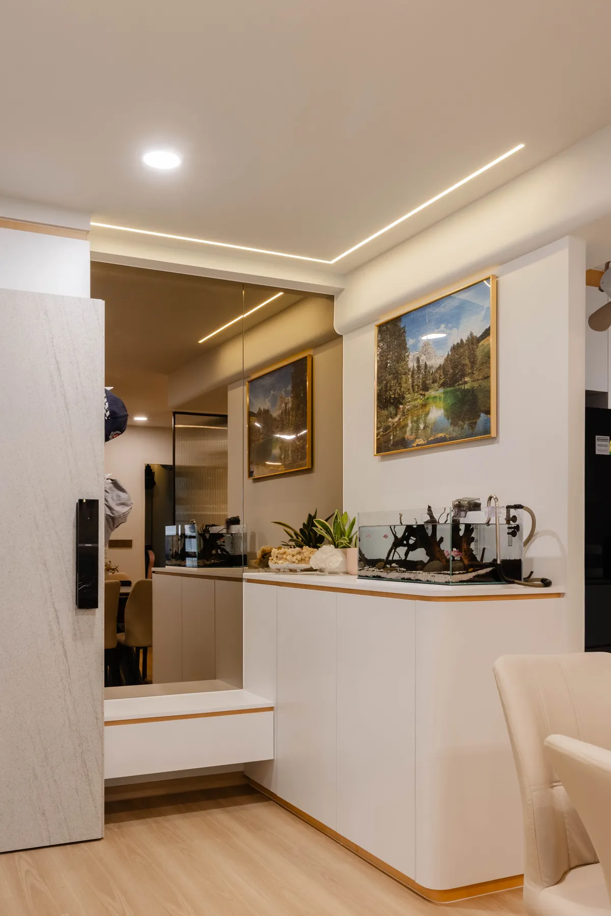 Hallway view into the kitchen with artwork at Fernvale St