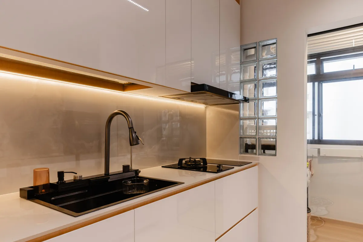 White kitchen with sink and hob run