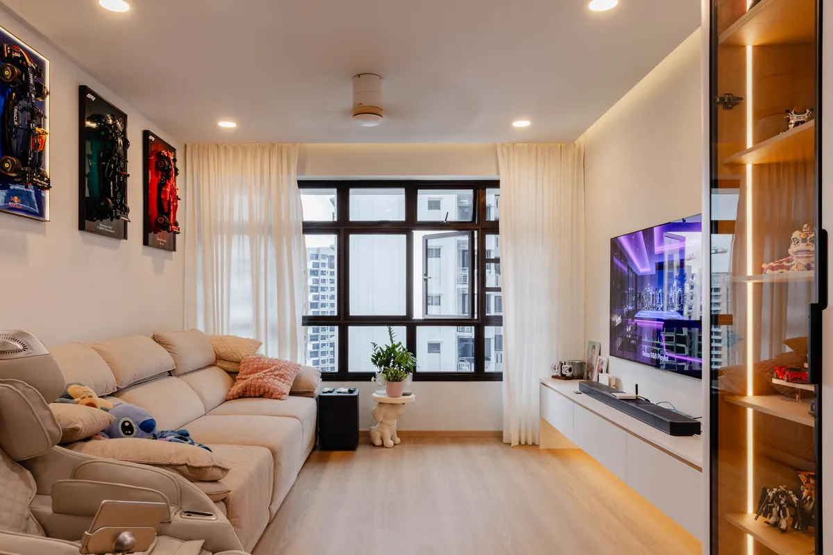 Living room in warm white with tap-to-light display cabinets at Fernvale St