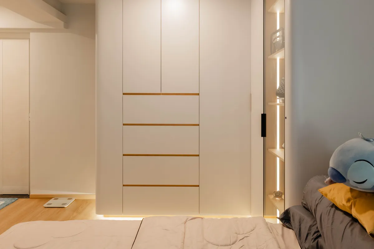 White wardrobe with brass inlay trim at Fernvale St