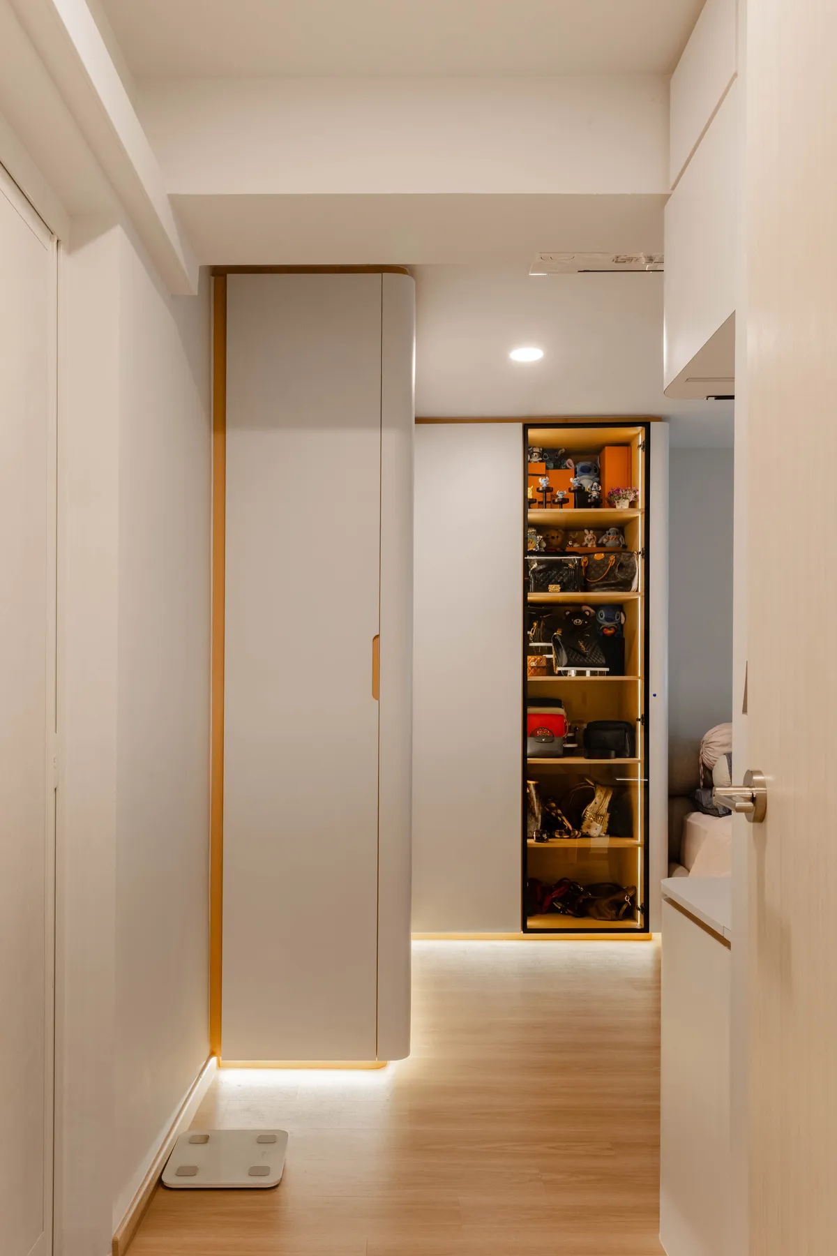 Open wardrobe with warm interior lighting